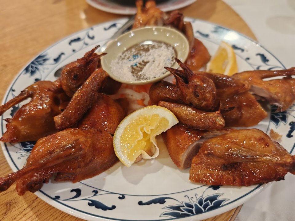 Chinese seafood dishes arranged for table service.